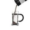 French press coffee maker pouring ground coffee